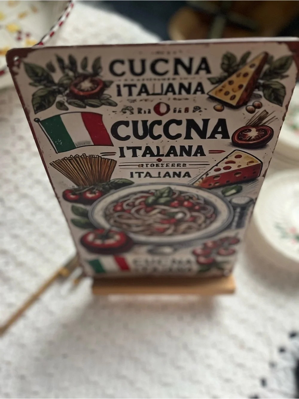 This rustic Italian cuisine metal tin sign features a vintage spaghetti and toma